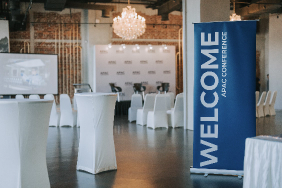 Welcome sign with white table cloth dinner  tables